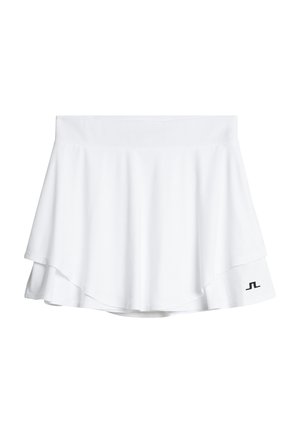 Vitt sportkjol med lagerdesign, elastisk midja och svart logotypdetalj på vänster nederkant. Slät, lättviktig tyg.