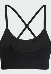 Μαύρο αθλητικό σουτιέν με ριγωτή ίσαλο, ρυθμιζόμενες λεπτές τιράντες και σχέδιο σταυρωτής πλάτης με λεία υφή. Ελαφρύ ύφασμα.