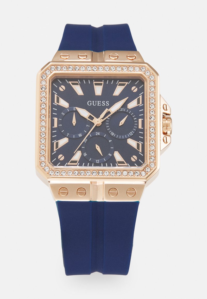 Quadratische Armbanduhr mit einem Gehäuse aus Roségold, blauer Zifferblatt und blauer Silikonarmband. Verfügt über Kristallakzente und drei Hilfszifferblätter für die Zeitmessung.