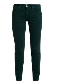 Mörkgröna corduroybyxor med en smal passform, tydlig ribbad textur, fem fickor samt metalldetaljer i form av knappar och nitar.