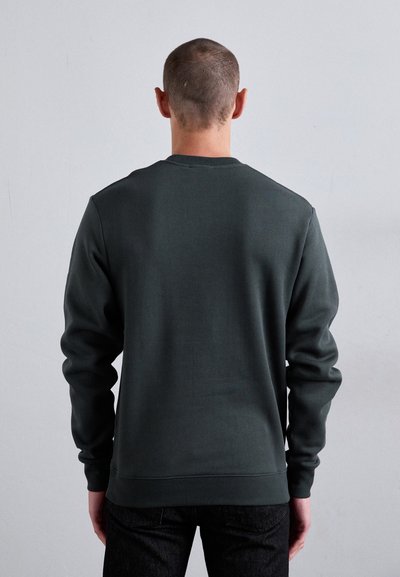 Dark green sweatshirt made of smooth fabric, featuring a crew neck and ribbed cuffs. Simple design with no visible logos or patterns.