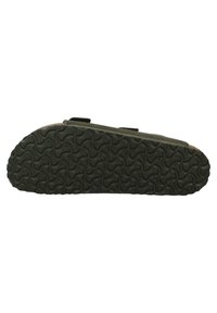 Talpa de pantof de un verde închis, cu un model texturat și ondulat pentru aderență. Include două curele negre din velcro pentru o fixare sigură.