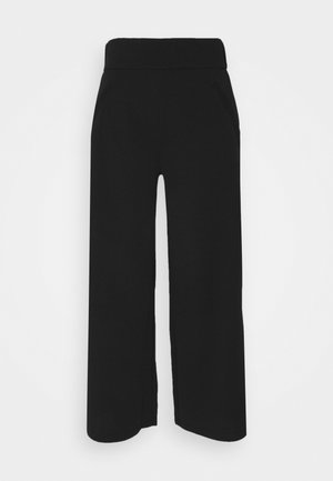 Pantalon noir à jambes larges avec une taille haute, coupe droite et poches latérales, présenté sur un fond blanc.