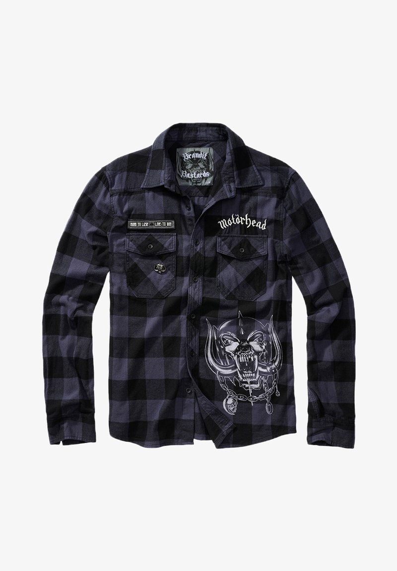 Camicia in flanella a scacchi neri e viola con maniche lunghe, caratterizzata da toppe ricamate e una grafica di un teschio con corna sulla parte anteriore.