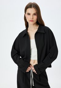 ZIPPED - Übergangsjacke - black
