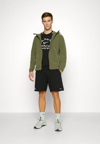 Nike Performance UNLIMITED - Trainingsjacke - medium olive/black