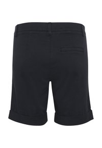 Svarta bomullsshorts med uppvikta ärmar, med en enda bakficka, slät textur och skräddarsydd passform. Minimalistisk design, inga utsmyckningar.