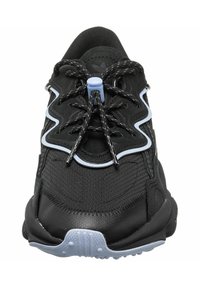 Black athletic shoes with a textured mesh upper, light blue accents along the sides, and a secure lacing system with a toggle closure.