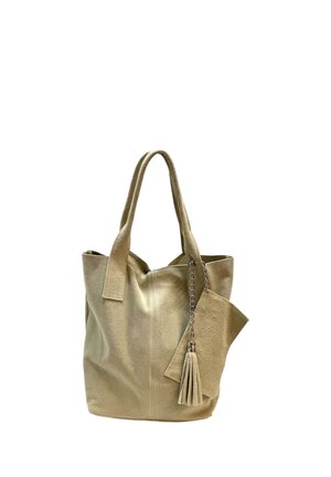 Beige suede tote bag with two handles and a matching tassel accessory attached by a silver chain.