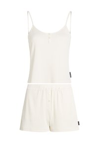 Valkoinen ribattua loungemekko-setti, jossa on hihaton toppi napilla ja vastaavat shortsit joustovyöllä. Pehmeä rakenne ja rento istuvuus.