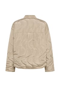 Beige quilted jacket with a smooth, shiny texture, featuring wavy stitching and a simple collar. Back view shows a relaxed, oversized fit.