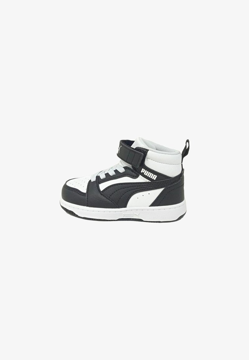 Black and white high-top sneakers with a textured leather upper, perforated toe, lace-up front, and adjustable strap closure.