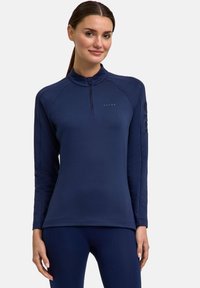 Marineblaues, langärmliges Sportoberteil mit halben Reißverschluss, Raglanärmeln und dezentem Logo auf der Brust. Glattes Material und enganliegendes Design.