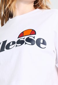 Ellesse Triko s potiskem - white