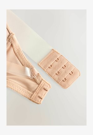 Beige bh met een gaasontwerp, verstelbare bandjes en een haak- en oogsluiting. Kenmerkt zich door gladde, zachte texturen en een naadloze afwerking.