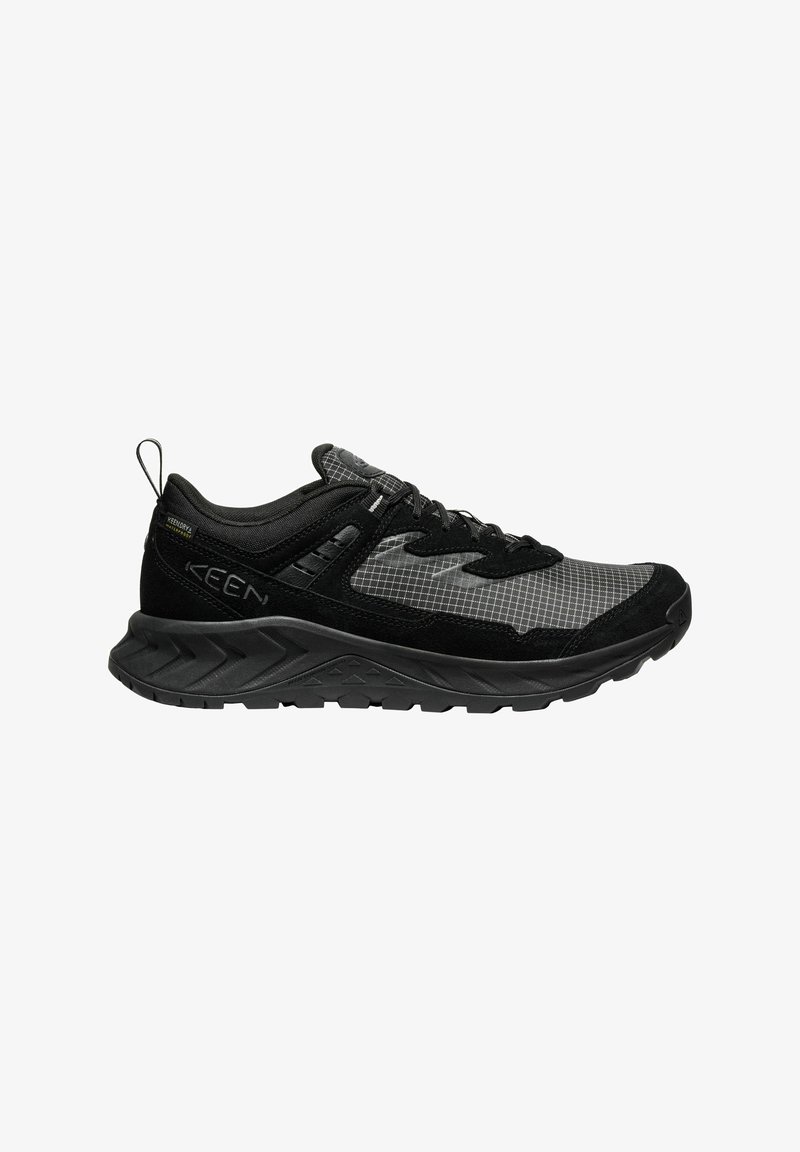 Black and gray hiking shoes with mesh and suede upper, laces, padded collar, and a rugged rubber sole featuring a textured tread pattern.