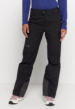 Pantaloni outdoor neri in materiale idrorepellente, con tasche con zip e cuciture rinforzate. Presentano un fit rilassato e una vita regolabile.