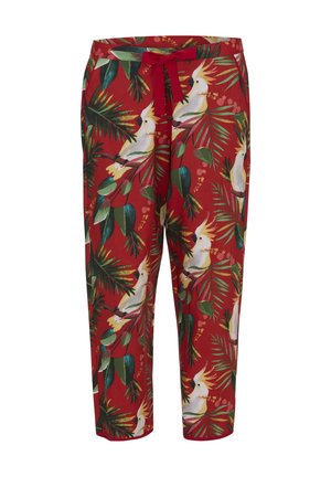 Pantalon rouge avec motif de feuilles vertes tropicales et oiseau cacatoès blanc, avec un cordon rouge à l'avant à la taille.