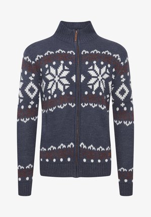 Tamsiai mėlynas džemperis su užtrauktuku, aukštu apykakle, su baltais ir rudais geometriniais raštais, megztos tekstūros ir raukšlėtomis rankovių bei apačios dalimis.