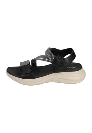 Sandalo sportivo in bianco e nero con cinturini regolabili e suola spessa imbottita beige, progettato per il comfort e l'uso casual.