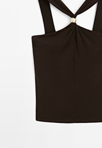 Dark brown sleeveless top with wide straps crossing and held by a small gold ring detail at the chest area.