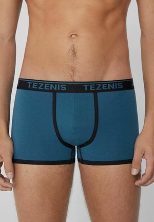 Tezenis Herren Boxershorts aus türkisfarbenem Stoff mit schwarz elastyischem Bund und kontrastierenden Nähten, die eine enge Passform und volle Abdeckung bieten.