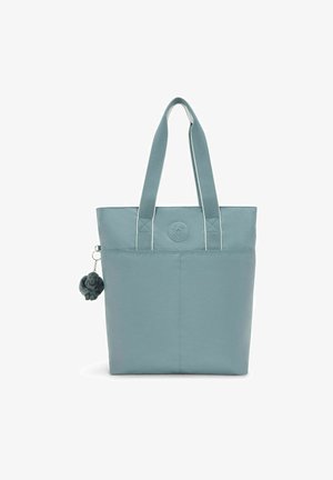 Light blue tote bag made from fabric with two sturdy handles. Features a round logo and a small plush charm attached to a zipper.