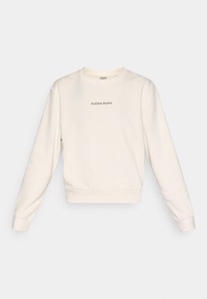 Κρεμ φούτερ φτιαγμένο από απαλό ύφασμα, με μακριά μανίκια και στρογγυλεμένο ντεκολτέ. Το λογότυπο «BJÖRN BORG» σε γκρι χρώμα βρίσκεται στο κέντρο του στήθους.