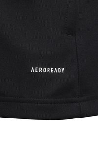 Sort atletisk stof med "AEROREADY" logoet i hvid. Materialet har en glat tekstur, med rene syninger og en tætsiddende pasform.