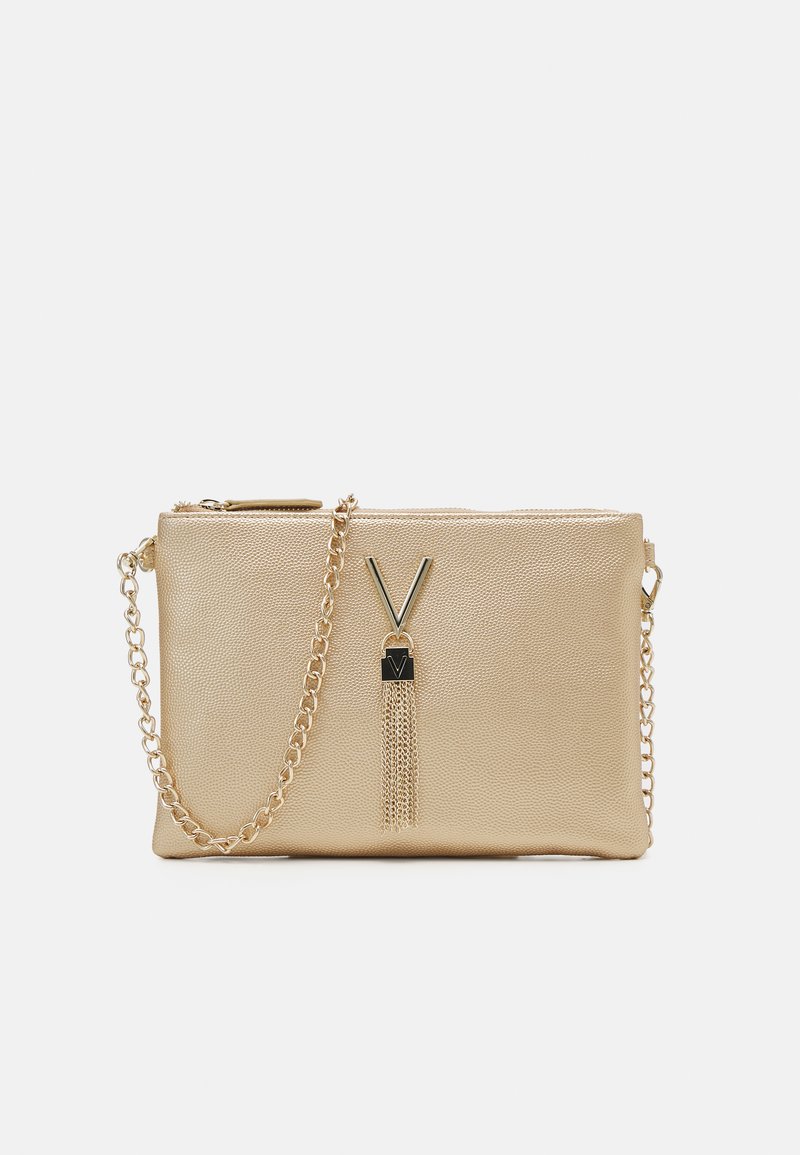 Gold-toned synthetic clutch with a textured surface, zipper closure, chain strap, and a tassel accent featuring a logo detail.