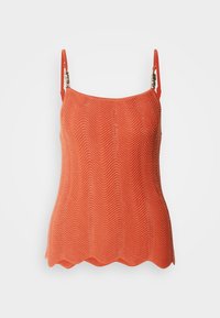 Haut tricoté orange avec un motif en zigzag, doté de bretelles ajustables et d'un ourlet festonné. Tissu léger avec une finition texturée.