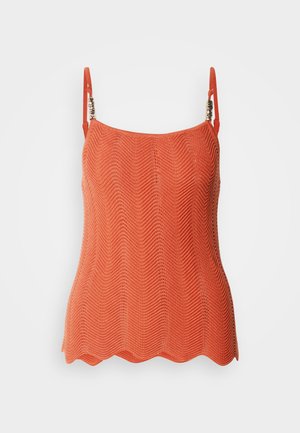 Zigzag mintázatú narancssárga kötött felső, állítható pántokkal és hullámos szegéllyel. Könnyű, texturált anyag.