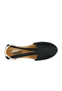 Black canvas espadrille with a rounded toe, elastic cross-straps, and a textured beige braided edge. Faux leather insole.