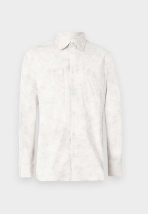 White long-sleeve shirt made of lightweight fabric. Features a button-up front, two chest pockets, and a classic collar with a textured pattern.