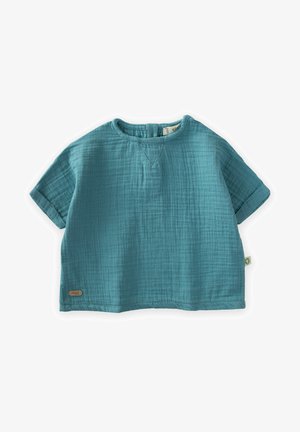 Mėlynas medvilninis trumpas_rankovėmis palaidinė su tekstūruota, raukšlėta medžiaga. Funkcijos apvalus iškirpimas ir sulankstyti rankogaliai. Maža logotipo etikete šone.