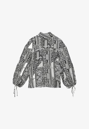 Blouse met lange mouwen in zwart-witte stof; met geometrische patronen, volumineuze mouwen en aantrekkoordjes bij de polsen.