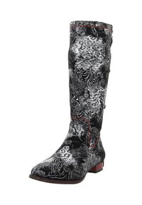 Black and white knee-high boots with a swirling abstract pattern, featuring red accents along the seams and a low, square heel.