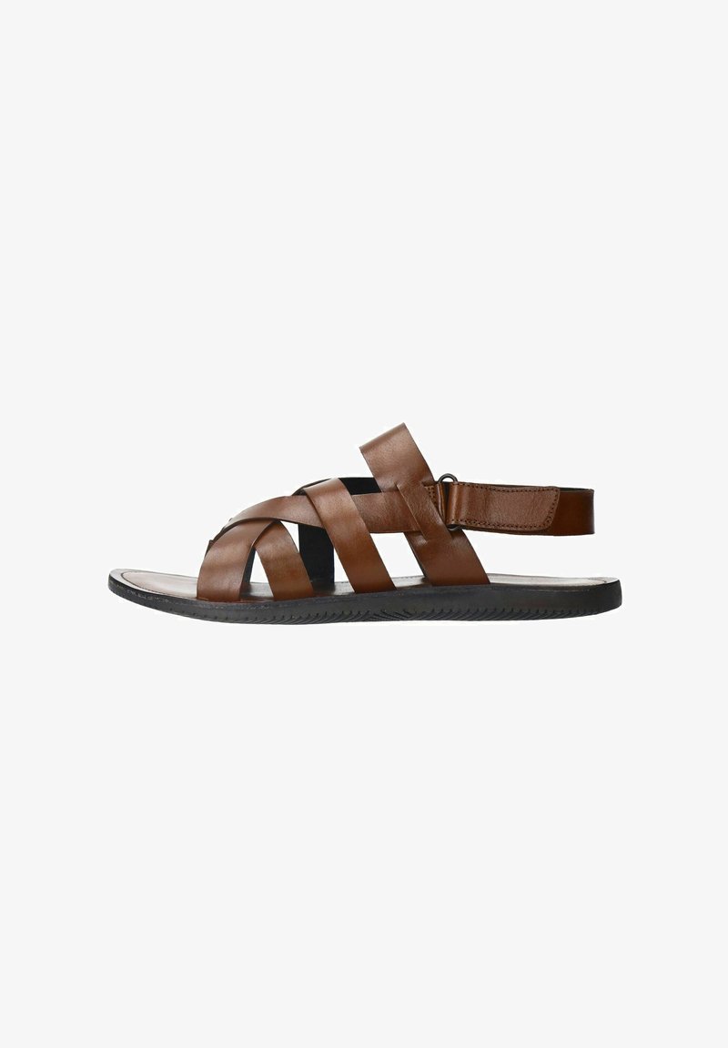 Brown leather sandal featuring crisscrossed straps, an open toe design, and a rear strap with hook-and-loop closure for a secure fit.
