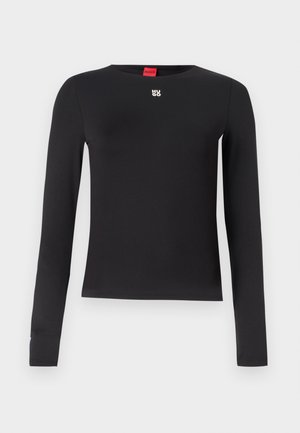 Black long-sleeve shirt made from smooth fabric. Features a crew neckline and a small silver logo on the chest. Minimalist design.