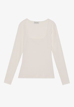 Dlhý rukáv, rebrovaný top v off-white farbe so štvorcovým výstrihom. Mäkká textúra a priliehavý strih, s označením "ANNA FIELD."