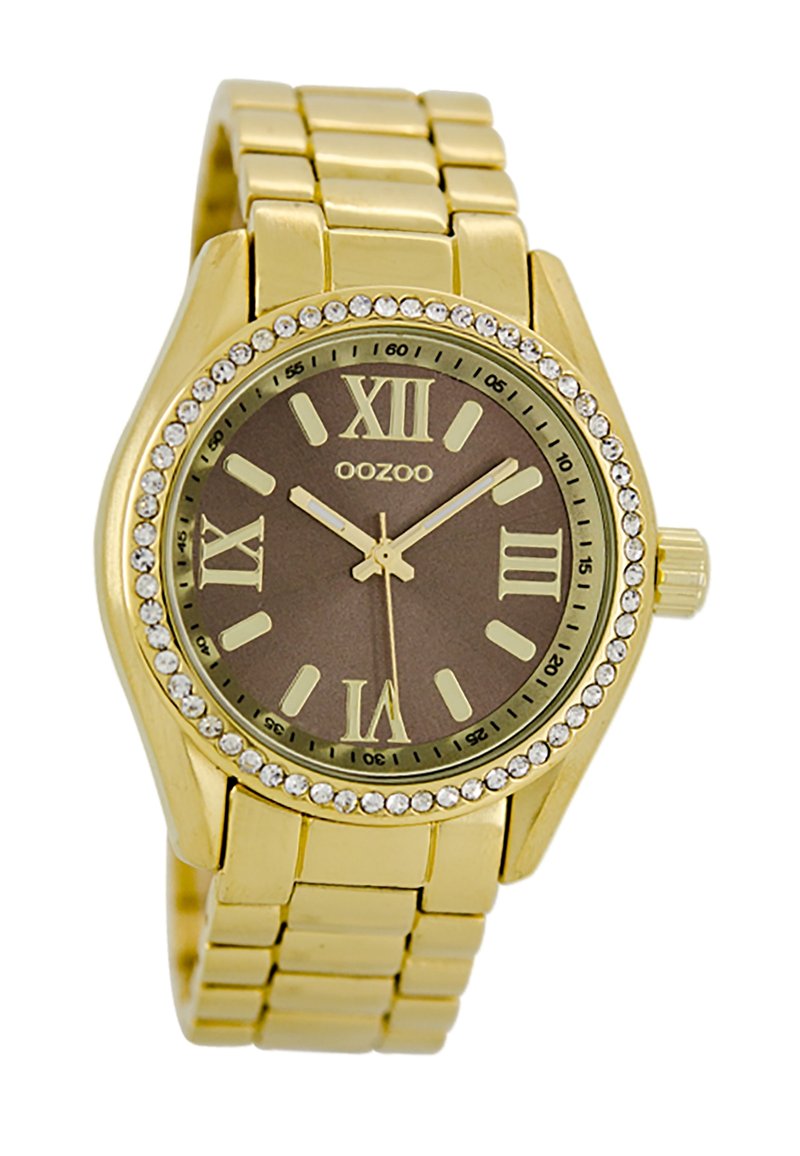 Montre bracelet en or avec un cadran rond marron, des chiffres romains, des index en or et une lunette ornée de crystals. Design de bracelet en maillons métalliques.