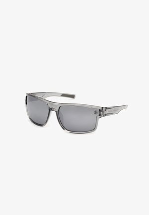 Sonnenbrille mit grauen getönten Gläsern, rechteckigen Kunststoffrahmen und metallischen Akzenten an den Bügeln; schlankes Design mit glänzender Oberfläche.
