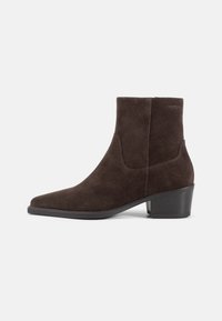 Brown suede ankle boot with a pointed toe and a mid-height block heel, featuring a smooth texture and slouched design.