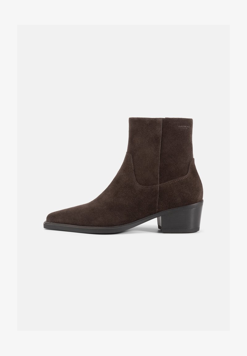 Brown suede ankle boot with a pointed toe and a mid-height block heel, featuring a smooth texture and slouched design.