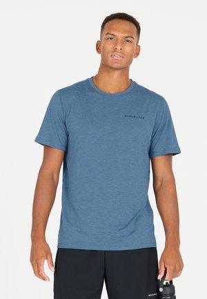 Men's blue crew-neck t-shirt made from soft, breathable fabric. Features short sleeves and a subtle logo on the chest, paired with black shorts.