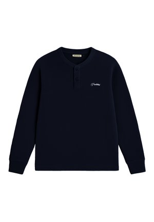 Navy blue long-sleeve henley shirt with two buttons and small white script logo on left chest.