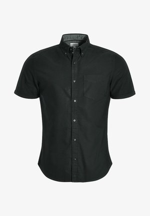 Chemise noire à manches courtes avec boutons en coton. Dispose d'un col, d'une poche avant et d'un ourlet droit. Texture unie et sans motifs.