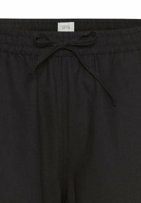 Zwarte drawstring broek met een elastische tailleband, gemaakt van lichtgewicht stof. Heeft een voegde naad aan de voorkant en een geweven label aan de binnenkant.