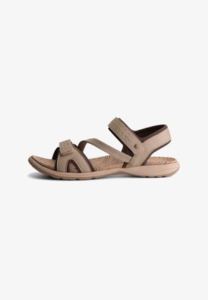 Beige Sandalen mit Kreuzriemen, aus texturiertem synthetischem Material. Verstellbare Klettverschlüsse und eine gewölbte, gemusterte Sohle.