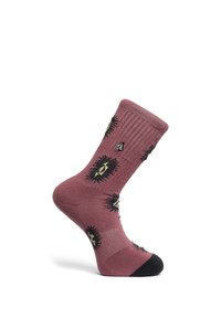 Chaussette montante mauve avec un bout noir et des motifs géométriques en forme d'éclat de soleil en noir, blanc et olive, présentée sur un pied mannequin sur fond blanc.